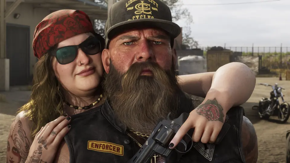 A biker couple in Ambrosia. She holds a revolver across his chest.