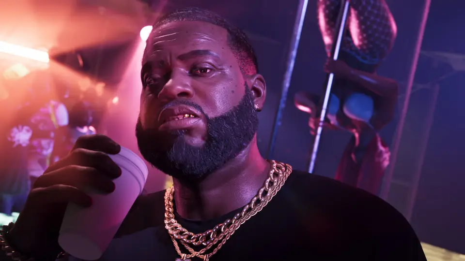 Boobie Ike with a drink in a club.