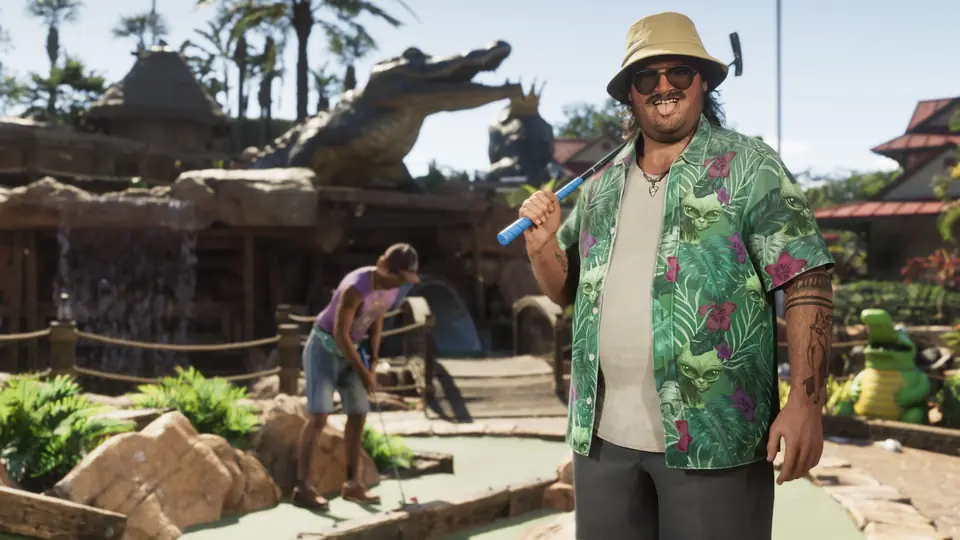 Cal Hampton with a club at a mini golf course.