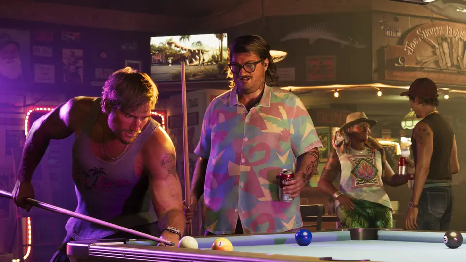 Cal Hampton watches a game of pool in a bar.