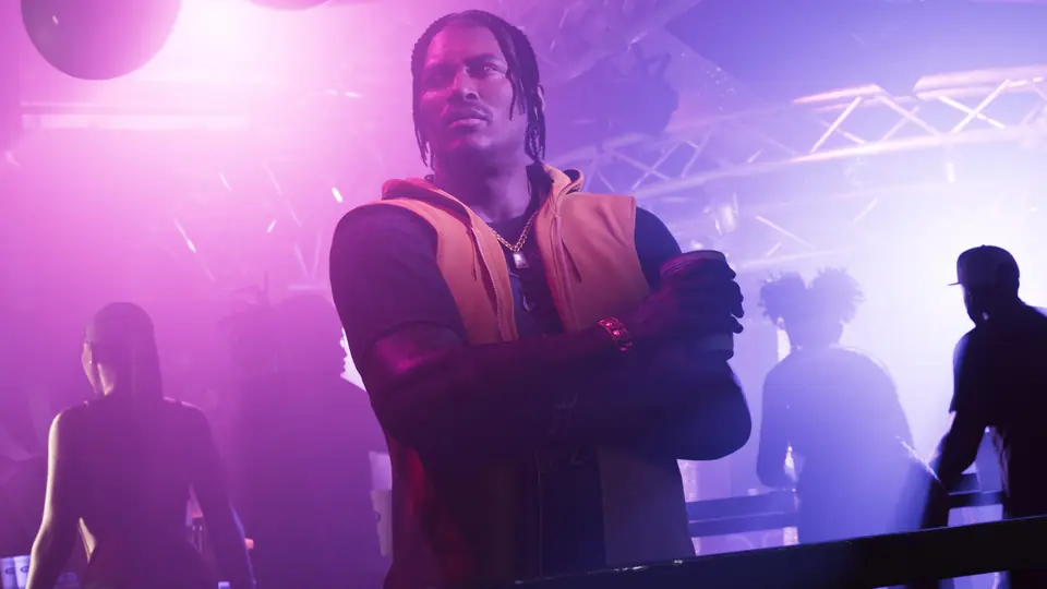 Dre'Quan Priest in a club under purple lights.