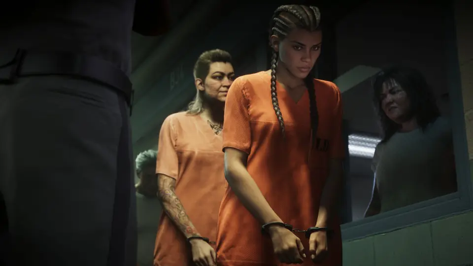 Lucia Caminos in a prison uniform and handcuffs.