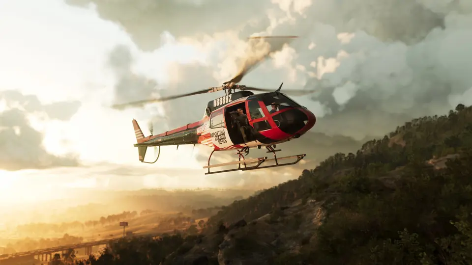 A news helicopter over a wooded ridge in Mount Kalaga National Park.