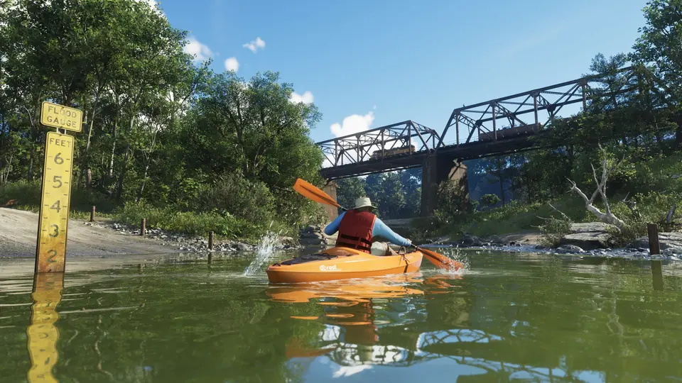 A kayaker paddles towards a bridge in Mount Kalaga National Park.