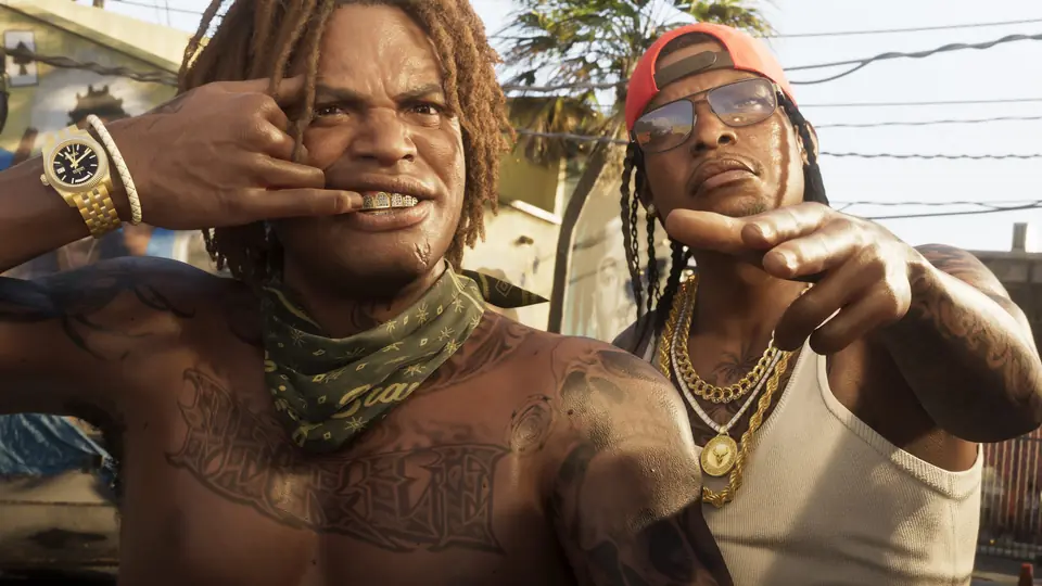 Two men in Vice City, one showing off his gold grill.